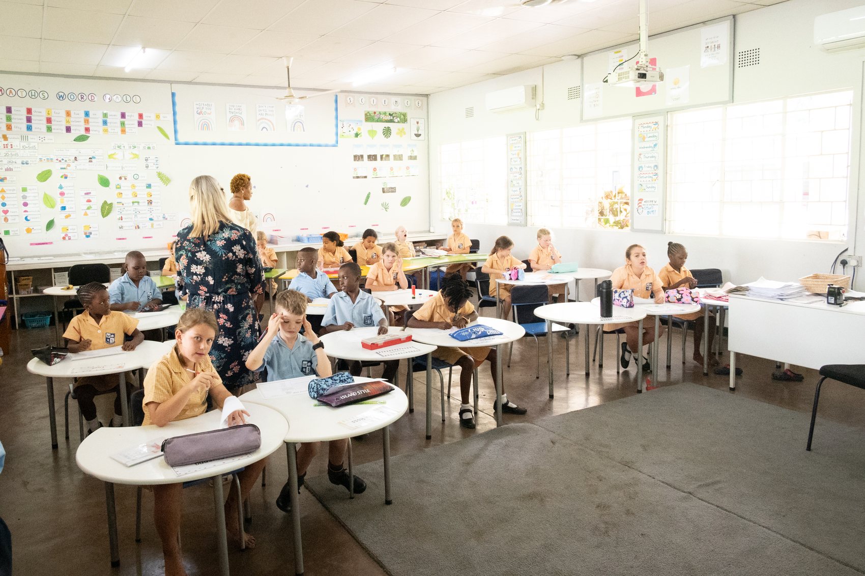 A Musikili class at work around tables in the classroom