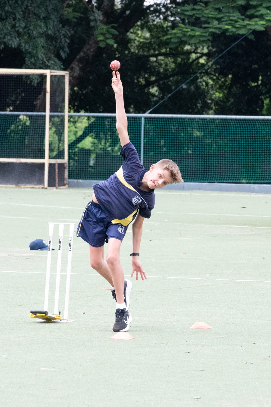 A pupil bowling at cricket practice